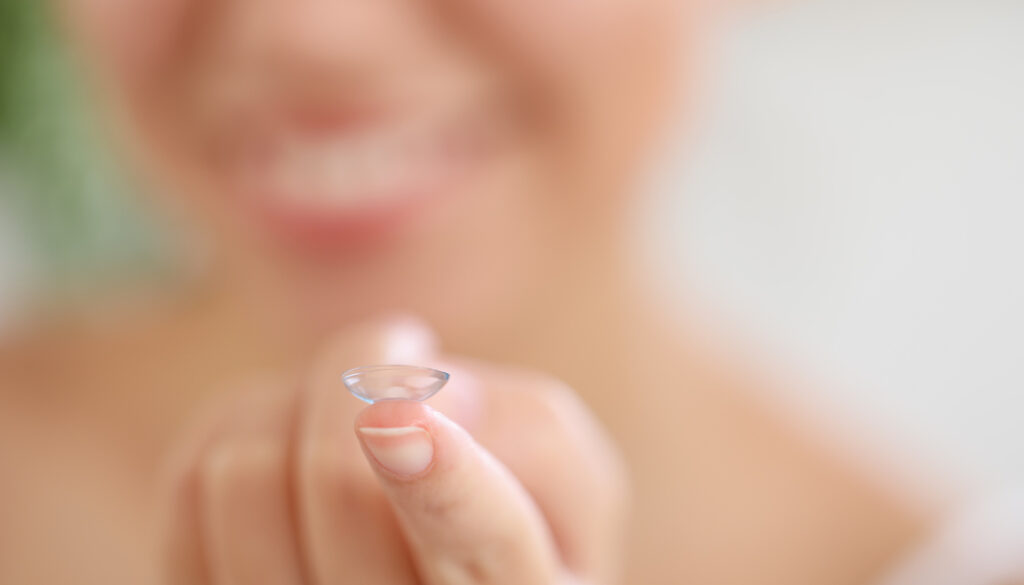 Young,African-american,Woman,With,Contact,Lens,At,Home,,Closeup