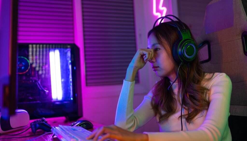 Eyes,Tired.,Gamer,And,E-sport,Online,Of,Asian,Woman,Playing