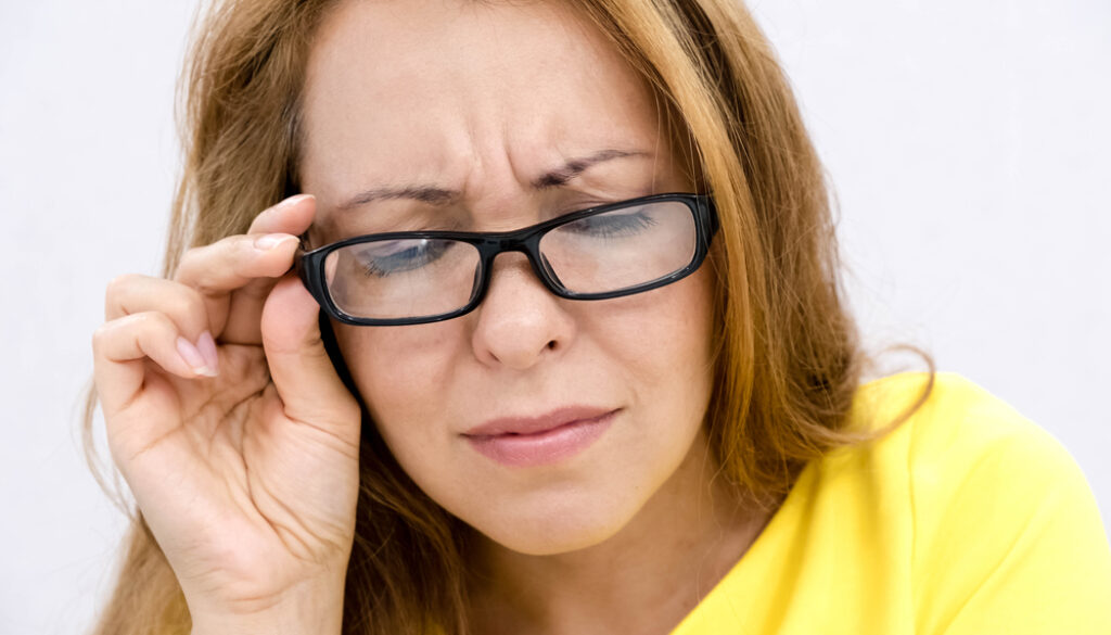 Mature,Woman,With,Black,Eye,Glasses,Trying,To,Read,Book,
